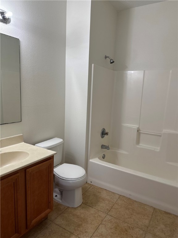 7710 15th Street Vero Beach, FL 32966 - Photo 19 of 25 a bathroom with a granite countertop toilet a sink and bathtub