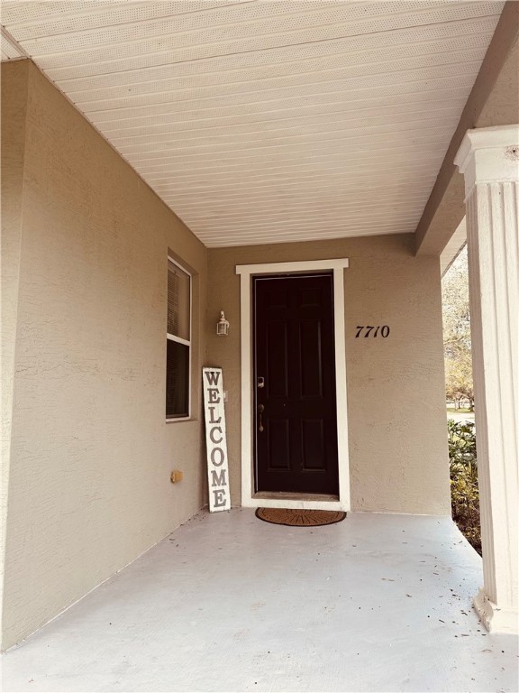 7710 15th Street Vero Beach, FL 32966 - Photo 2 of 25 an empty room with windows