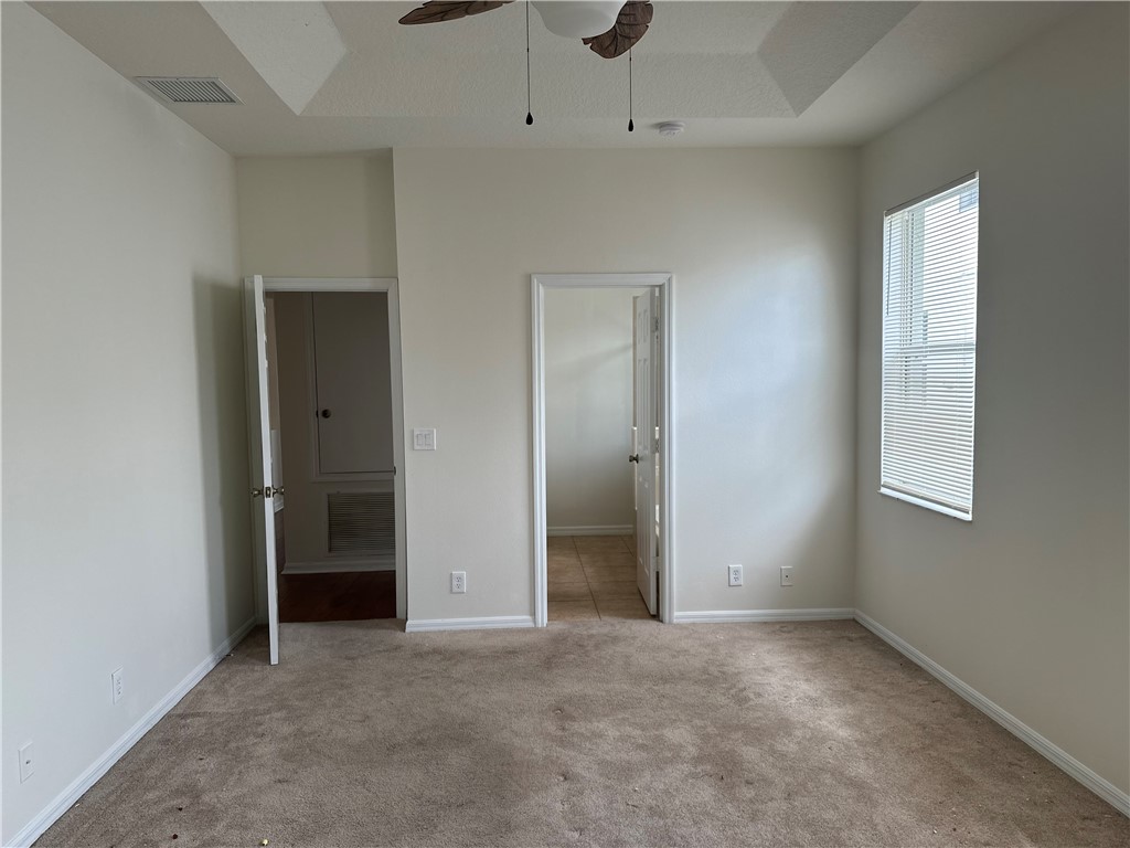 7710 15th Street Vero Beach, FL 32966 - Photo 10 of 25 an empty room with windows and closet