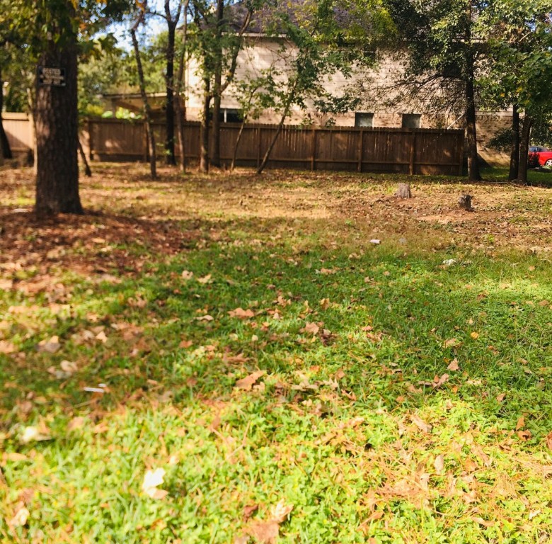 8630 Discus Drive Humble, TX 77346 - Photo 5 of 9 a view of a yard with trees