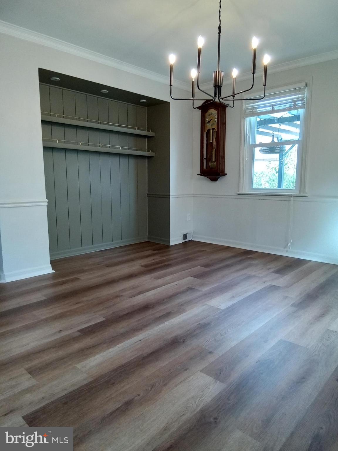 1917 Griffith Street Philadelphia, PA 19111 - Photo 17 of 50 an empty room with wooden floor kitchen view and windows