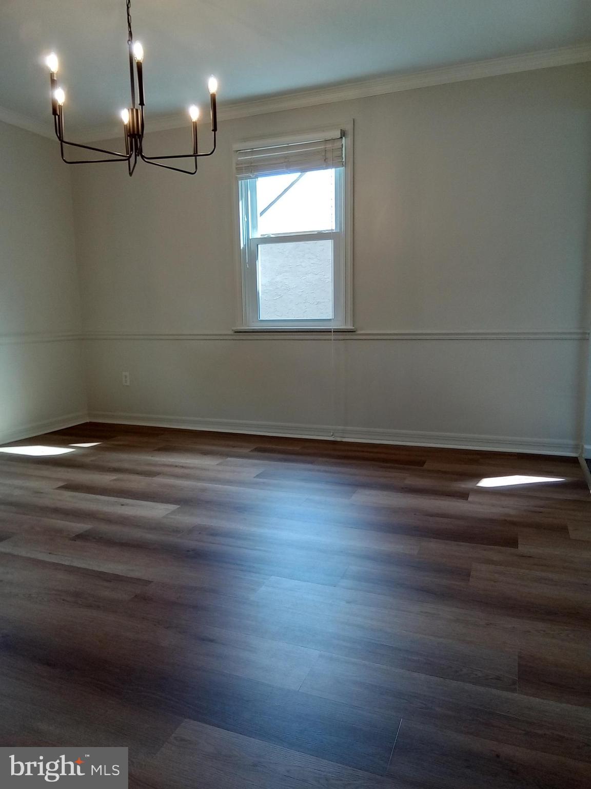 1917 Griffith Street Philadelphia, PA 19111 - Photo 19 of 50 an empty room with wooden floor and windows