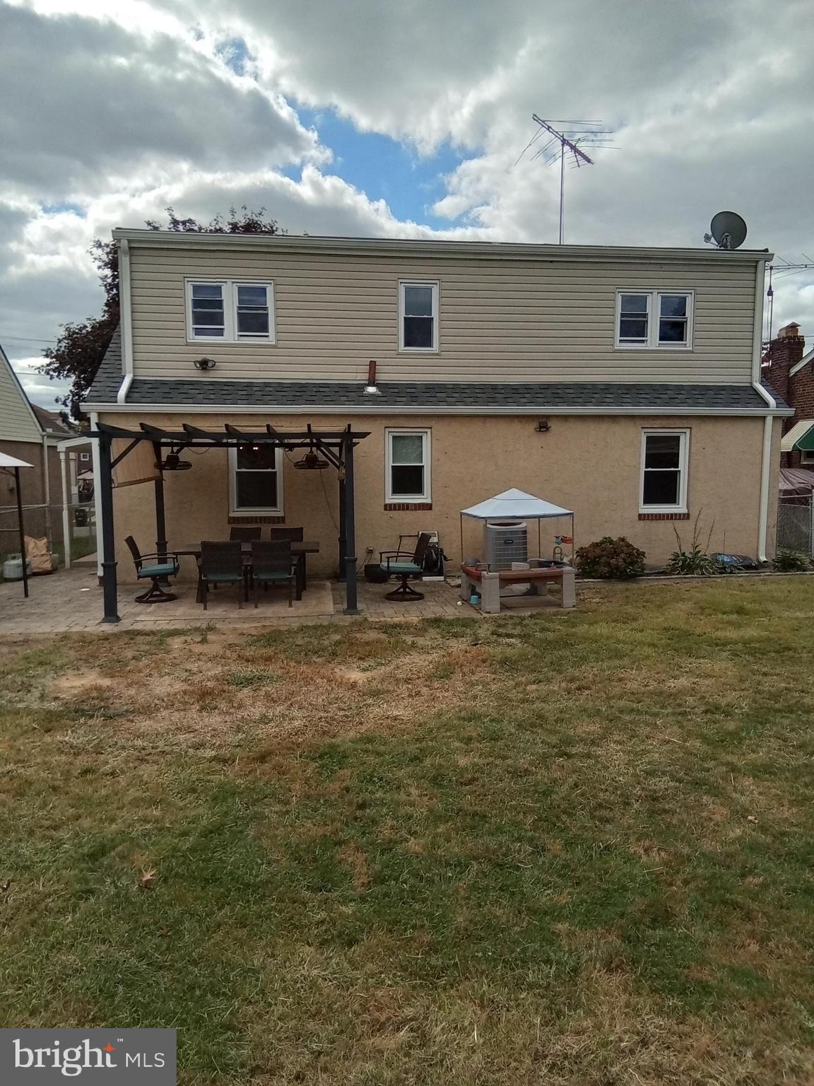 1917 Griffith Street Philadelphia, PA 19111 - Photo 4 of 50 a backyard of a house with table and chairs