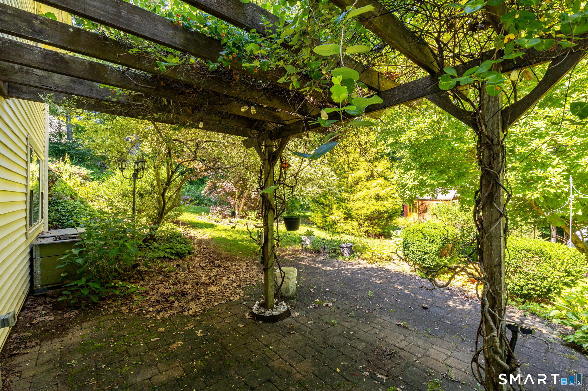 101 S Road Marlborough, CT 06447 - Photo 28 of 39 The walkout lower level opens to a paver patio with a pergola!