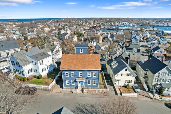 an aerial view of residential houses with outdoor space
