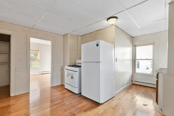 a kitchen with stainless steel appliances a refrigerator and a stove