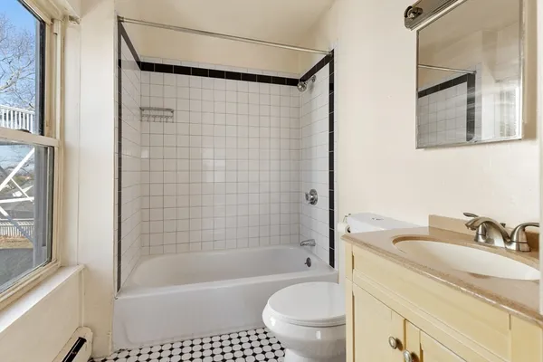 a bathroom with a shower a sink a toilet and a bathtub