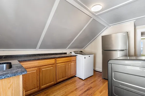 a hallway with washer and dryer
