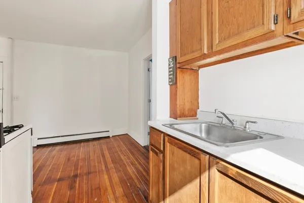 a kitchen with a sink and a window
