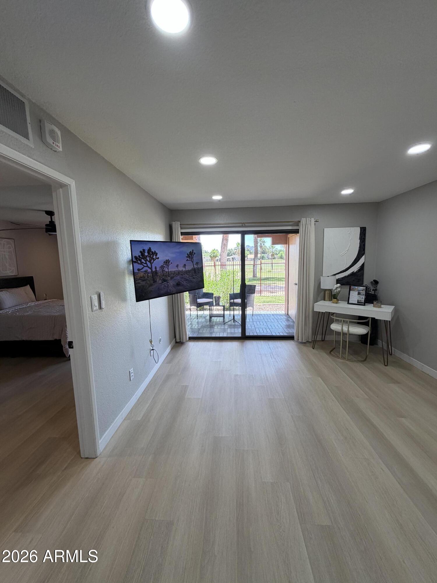 4303 East Cactus Road, Unit 128 Phoenix, AZ 85032 - Photo 37 of 39 a view of a livingroom with furniture and an entryway