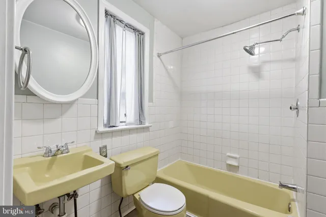 a bathroom with a sink toilet and bathtub
