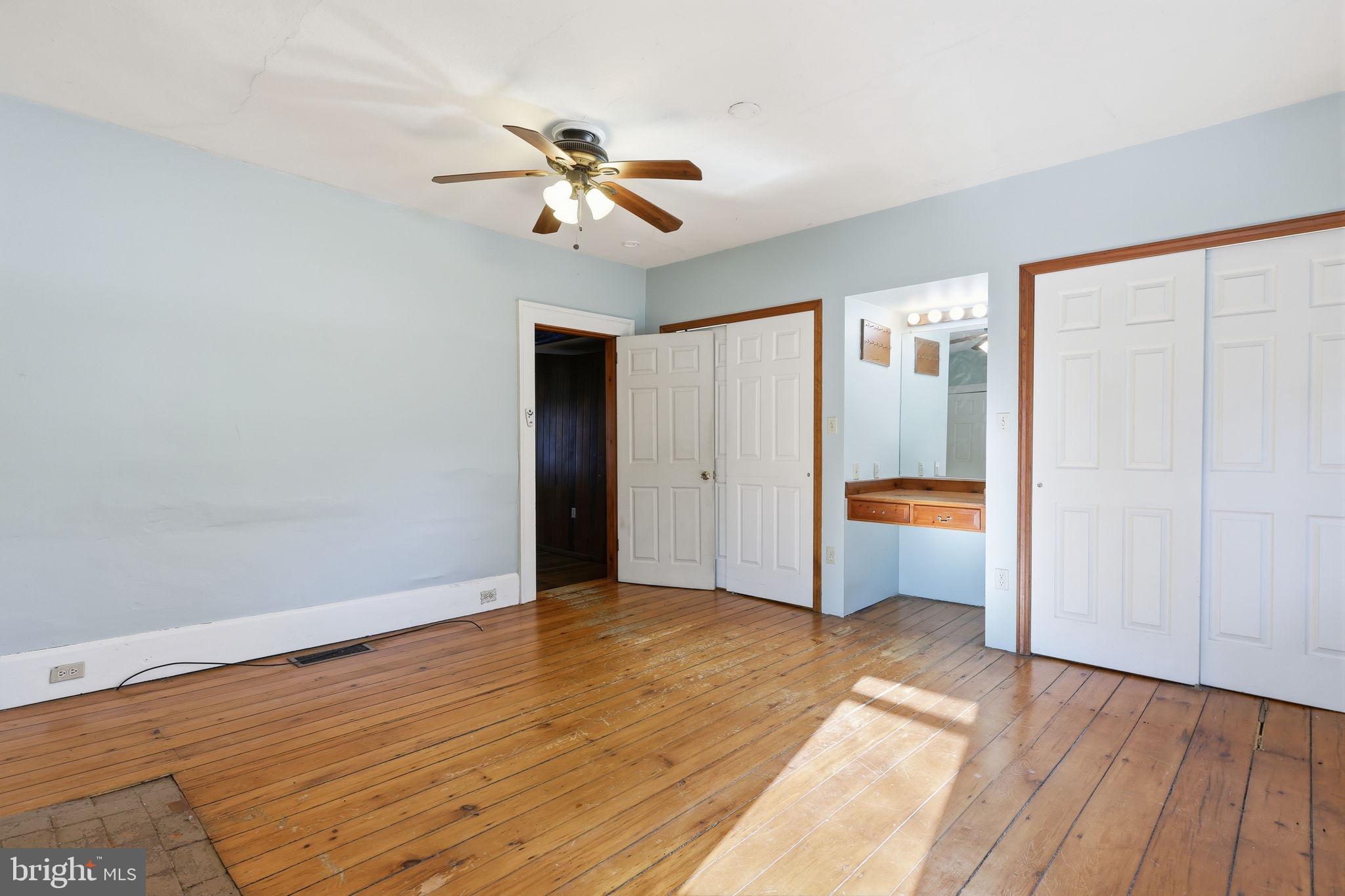 2695 Main Street Lawrence Township, NJ 08648 - Photo 13 of 50 a view of empty room with wooden floor and fan