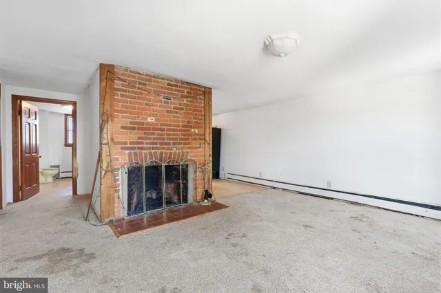 a bathroom with a toilet and shower