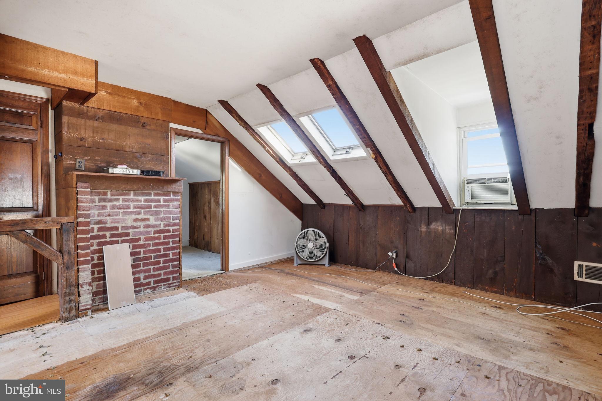 2695 Main Street Lawrence Township, NJ 08648 - Photo 27 of 50 a view of an empty room with wooden stairs