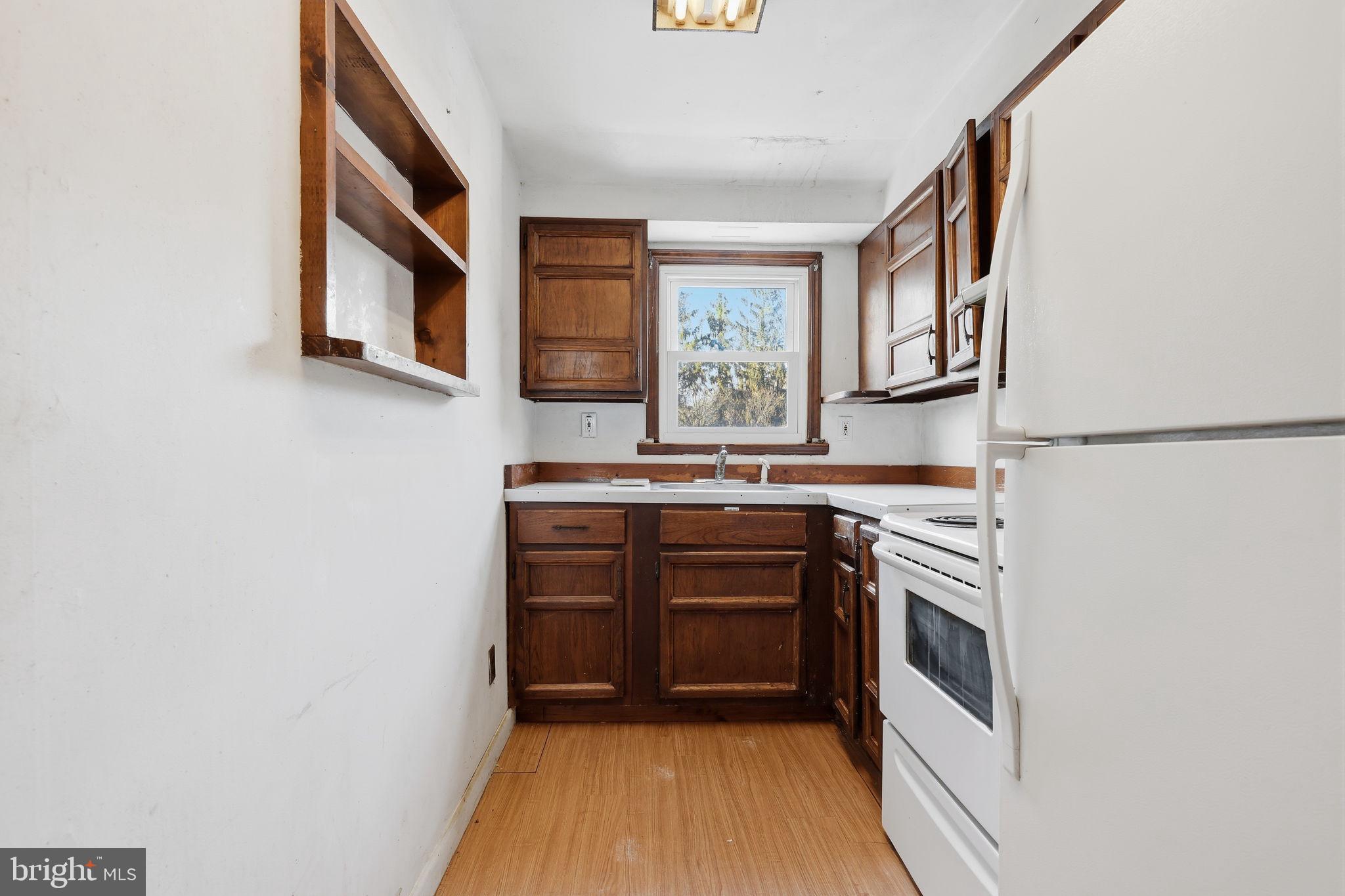 2695 Main Street Lawrence Township, NJ 08648 - Photo 30 of 50 a kitchen with stainless steel appliances granite countertop a stove and a sink