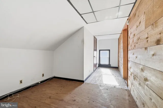 a view of a big room with wooden walls