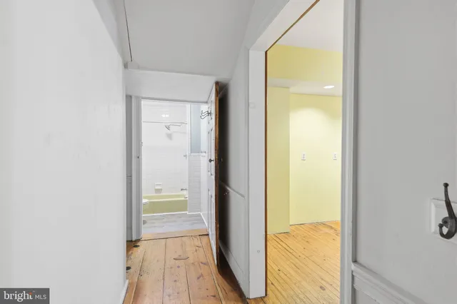 a view of a bathroom from a hallway