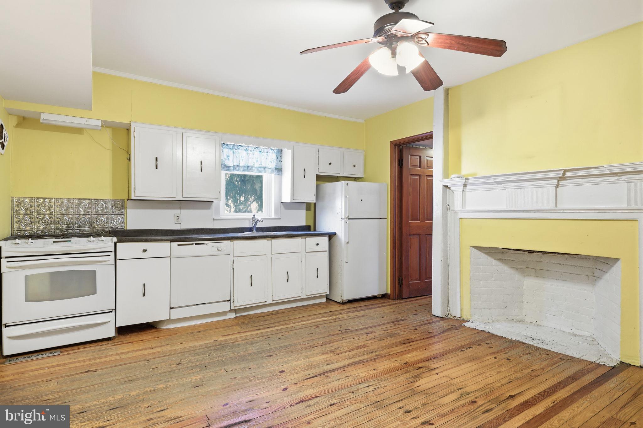 2695 Main Street Lawrence Township, NJ 08648 - Photo 7 of 50 a kitchen with stainless steel appliances granite countertop a stove a sink and a refrigerator