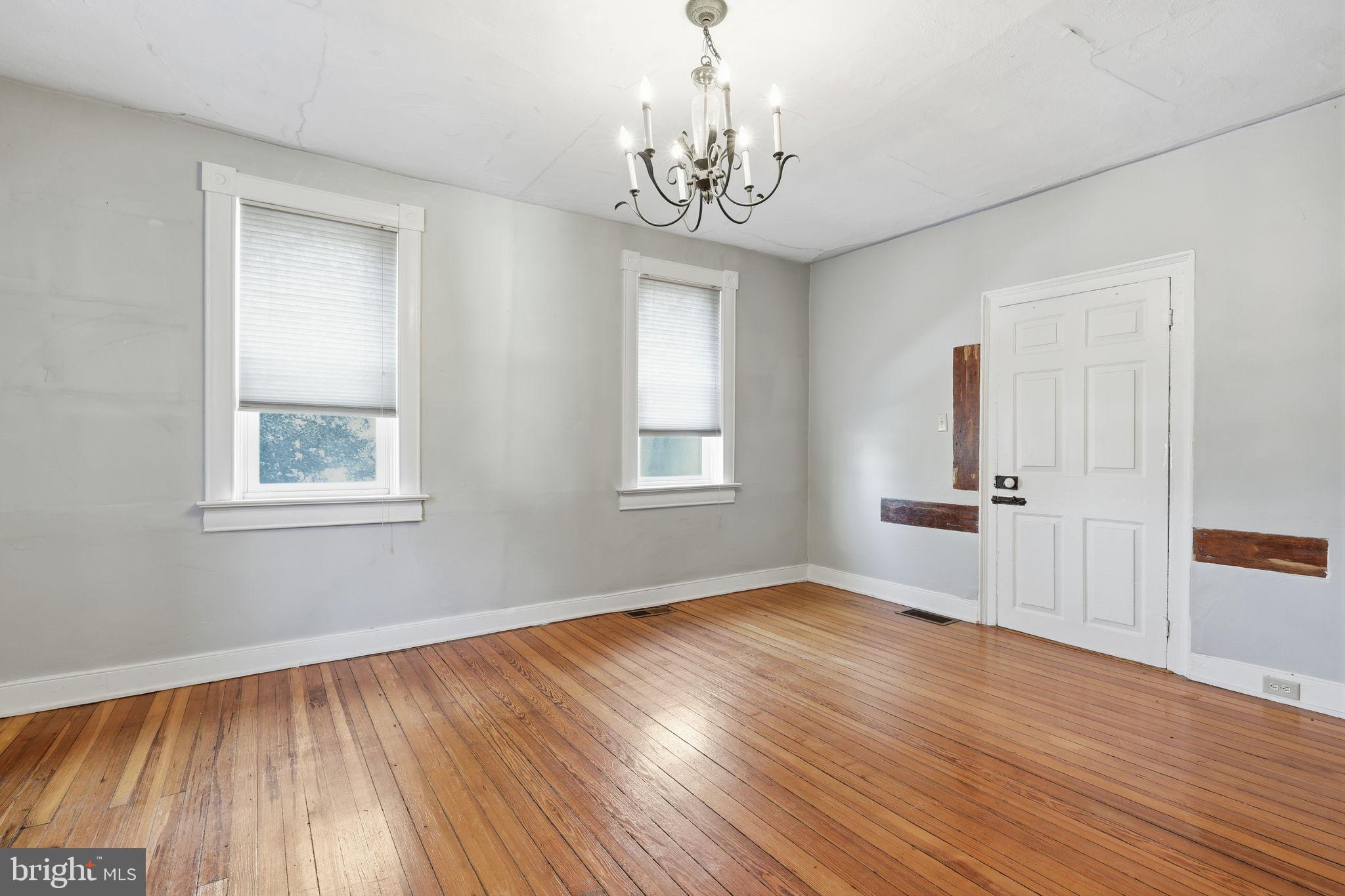 2695 Main Street Lawrence Township, NJ 08648 - Photo 9 of 50 a view of an empty room with wooden floor and a window