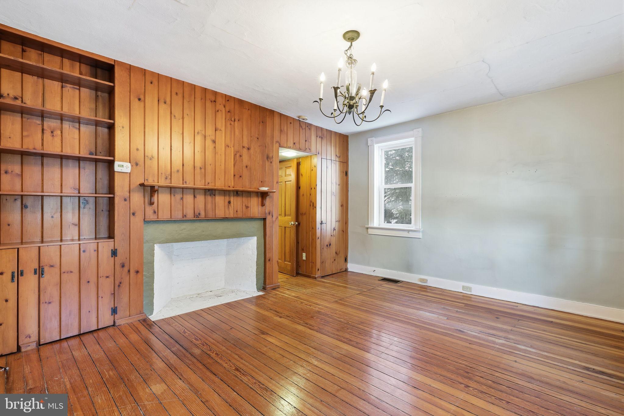 2695 Main Street Lawrence Township, NJ 08648 - Photo 10 of 50 a view of an empty room with a window and wooden floor