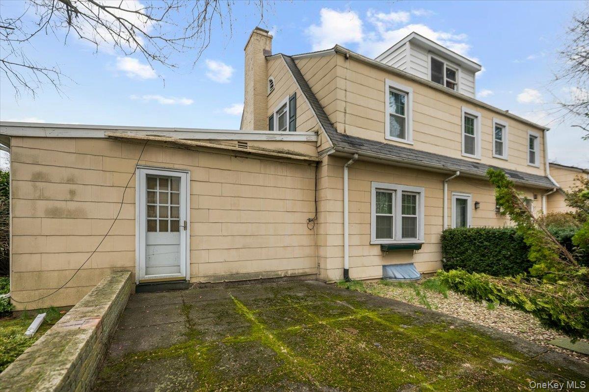 1 Edna Place New Rochelle, NY 10804 - Photo 20 of 24 a view of a white house with large door