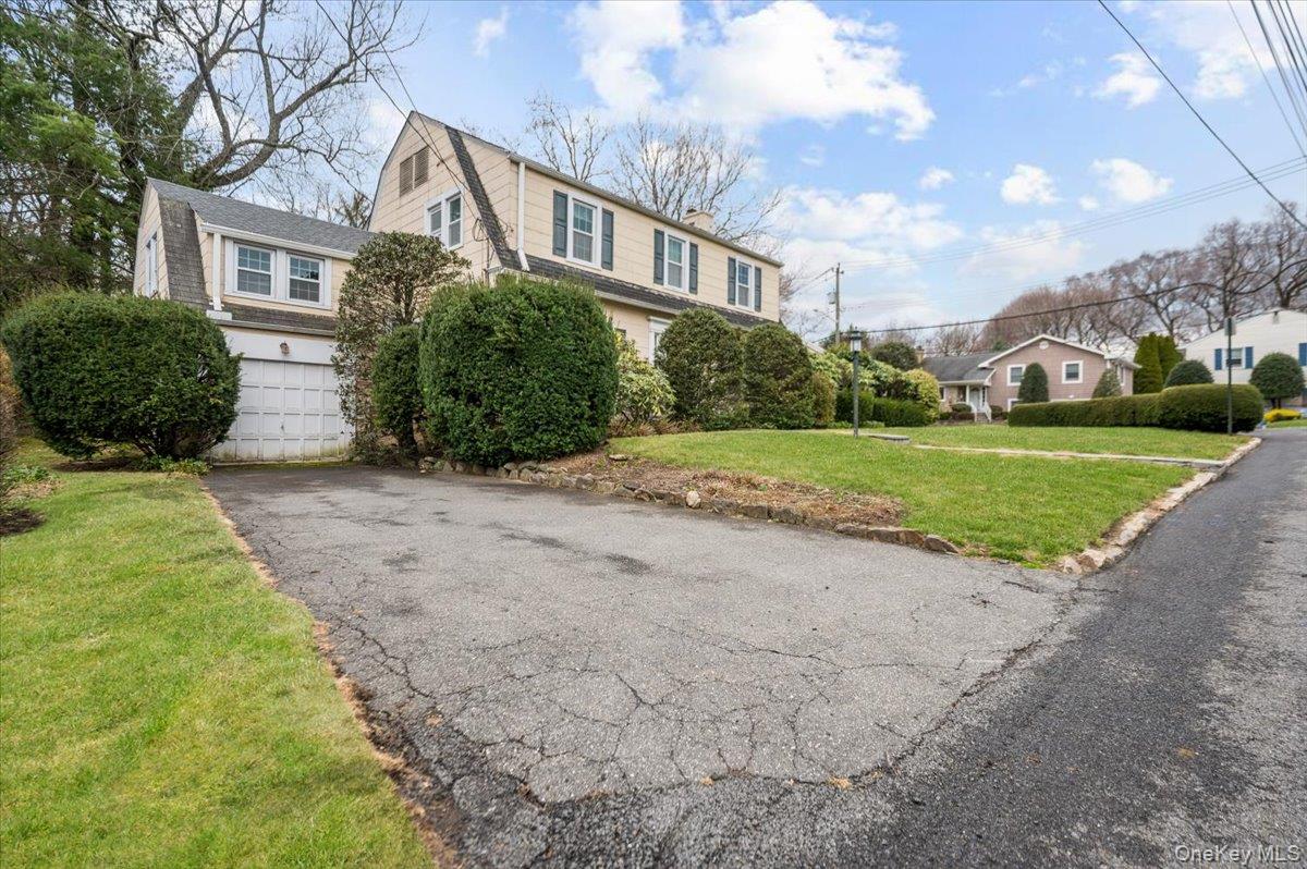 1 Edna Place New Rochelle, NY 10804 - Photo 23 of 24 a view of a big house with a big yard and potted plants