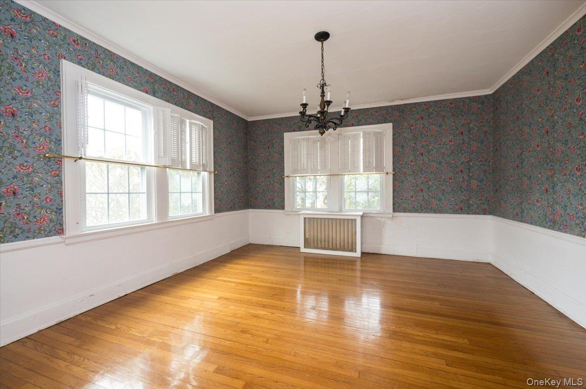 1 Edna Place New Rochelle, NY 10804 - Photo 7 of 24 a view of empty room with wooden floor and fan