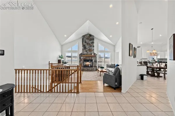 a living room with furniture fireplace and a flat screen tv