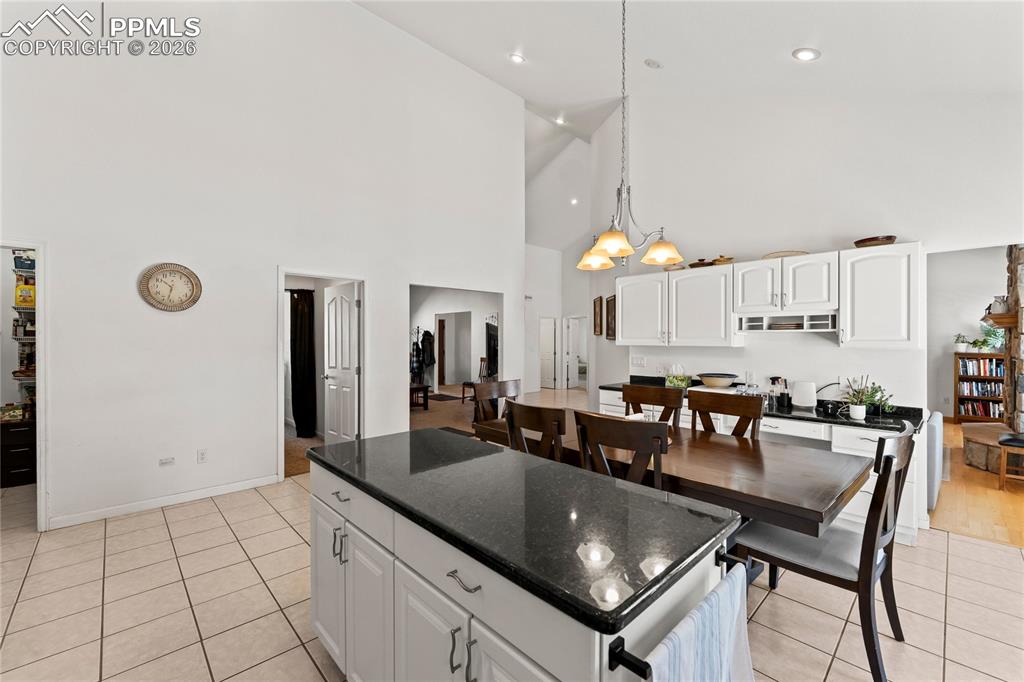 112 Ridge Point Circle Divide, CO 80814 - Photo 19 of 50 a kitchen with stainless steel appliances granite countertop a sink a stove and a refrigerator