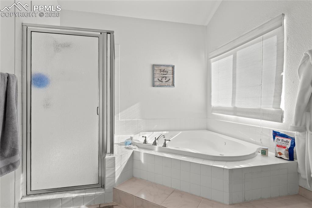 112 Ridge Point Circle Divide, CO 80814 - Photo 27 of 50 a white bath tub sitting next to a white sink