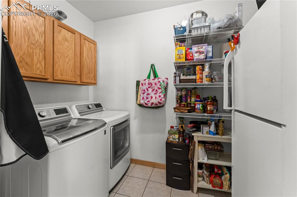 112 Ridge Point Circle Divide, CO 80814 - Photo 29 of 50 a kitchen with stainless steel appliances granite countertop a refrigerator and a stove
