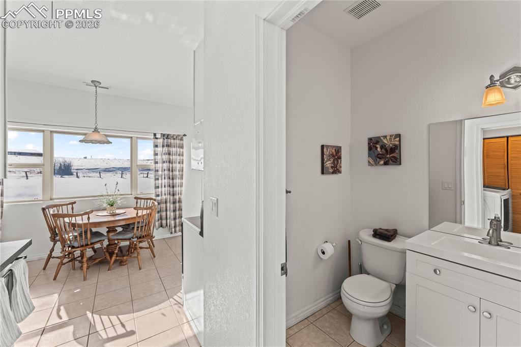 112 Ridge Point Circle Divide, CO 80814 - Photo 41 of 50 a bathroom with a toilet a sink and a mirror