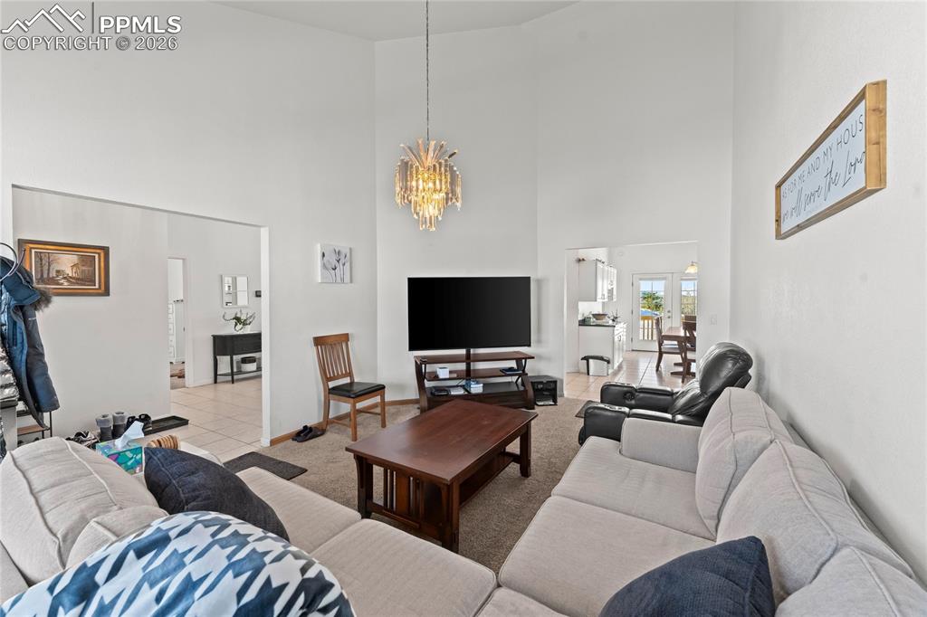 112 Ridge Point Circle Divide, CO 80814 - Photo 9 of 50 a living room with furniture and a flat screen tv