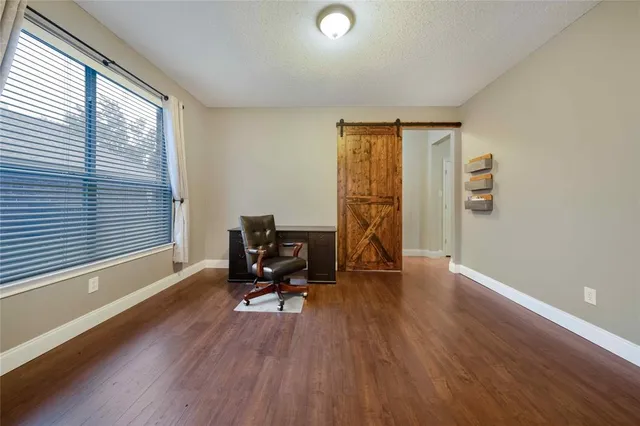 a view of workspace with furniture and a window