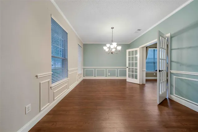 a view of a livingroom with wooden floor and fireplace