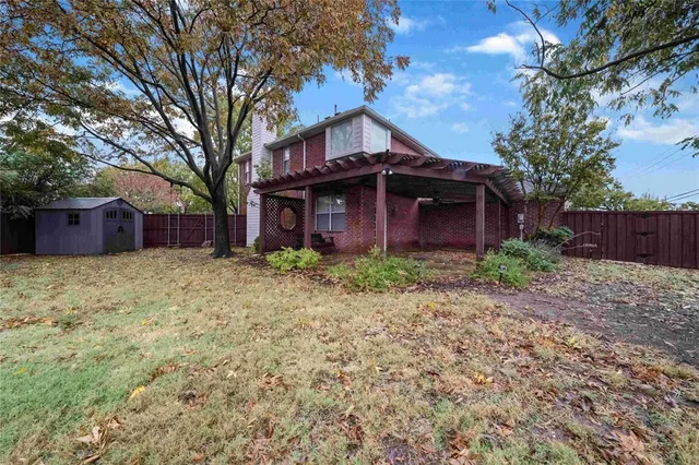 a front view of house with a garden