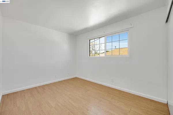 a kitchen with a sink a refrigerator and window