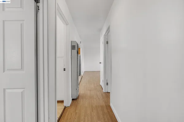 a view of stairs and wooden floor