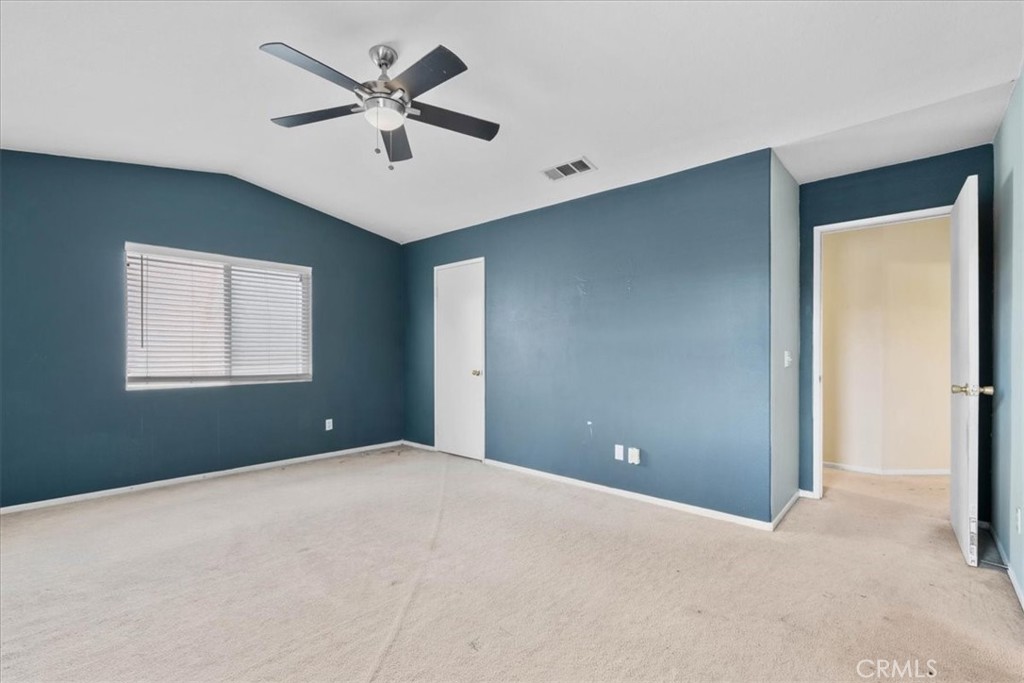 1474 Albillo Loop Perris, CA 92571 - Photo 17 of 35 a view of an empty room with a window