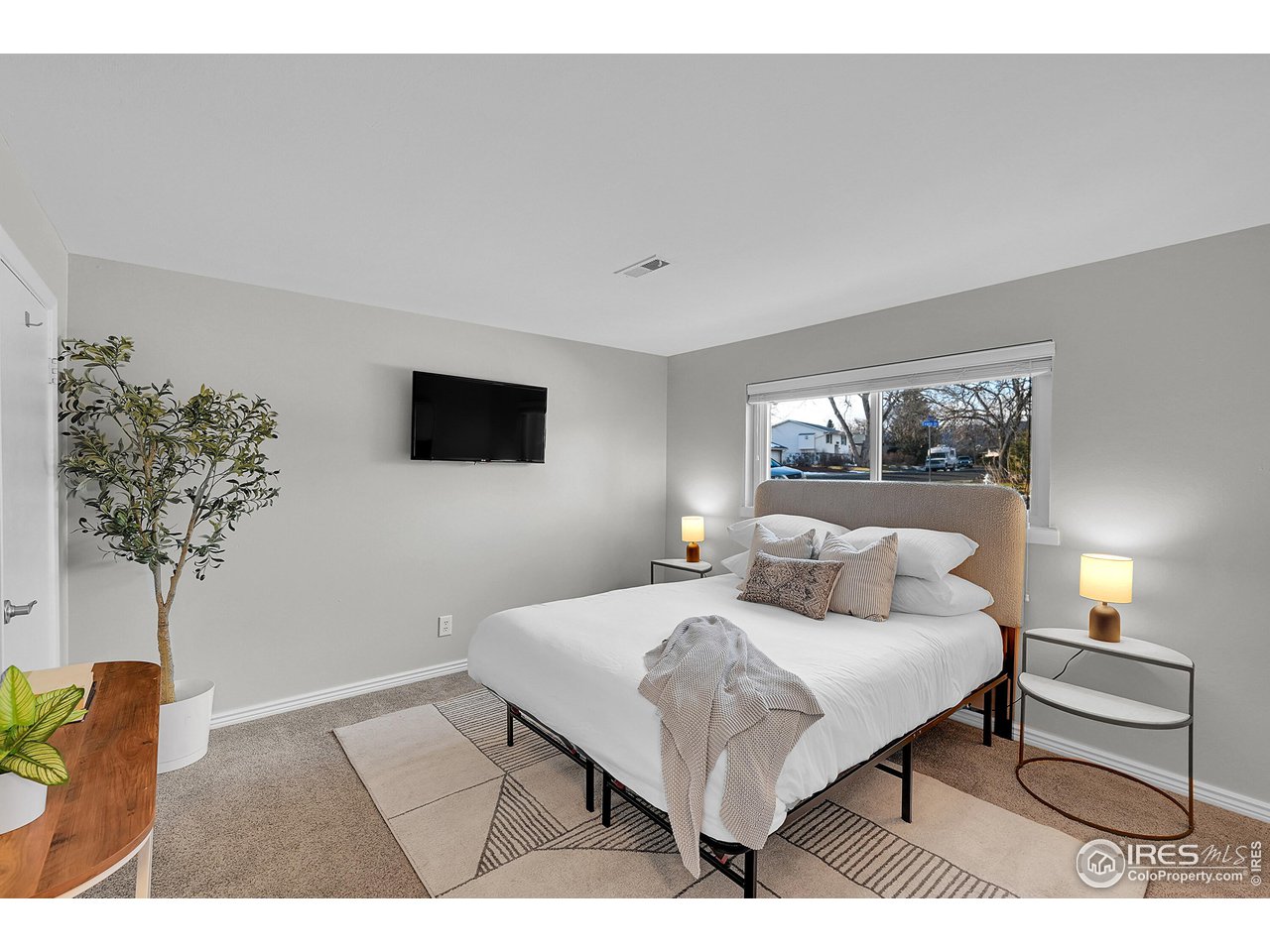 4216 Evans Drive Boulder, CO 80303 - Photo 13 of 26 a bedroom with a bed and a night stand