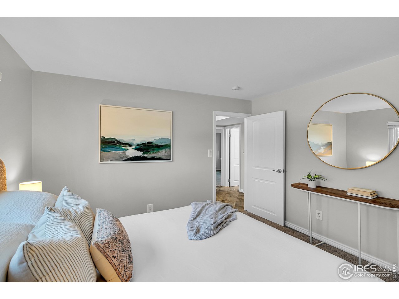 4216 Evans Drive Boulder, CO 80303 - Photo 15 of 26 a bedroom with a bed and a mirror