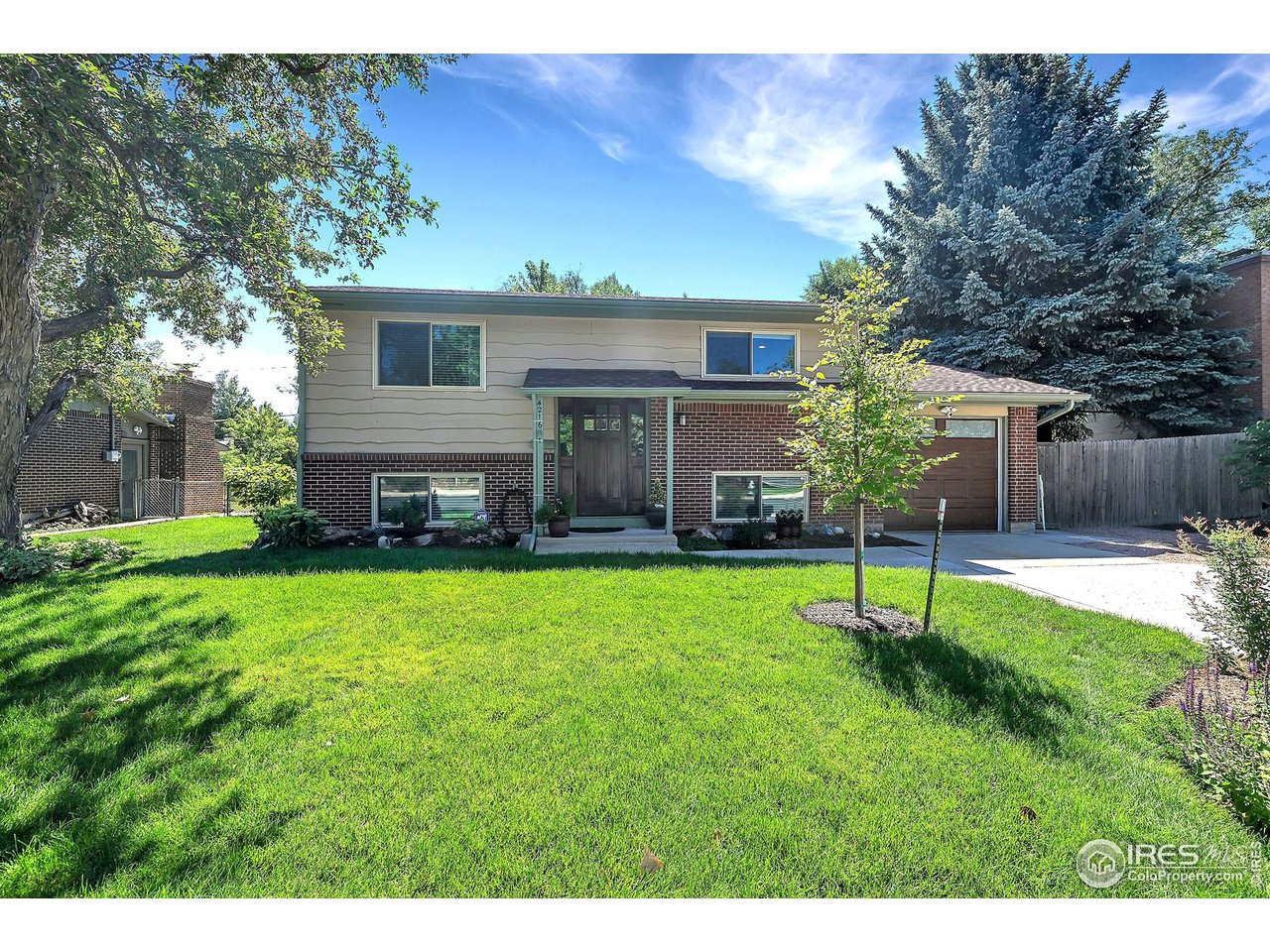 4216 Evans Drive Boulder, CO 80303 - Photo 2 of 26 a view of a backyard with a garden and plants