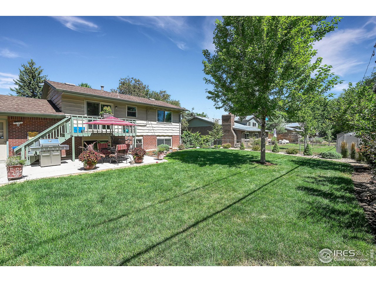 4216 Evans Drive Boulder, CO 80303 - Photo 22 of 26 a view of a house with a back yard