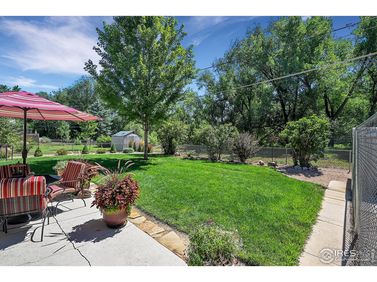 4216 Evans Drive Boulder, CO 80303 - Photo 23 of 26 a view of a backyard with sitting area and garden