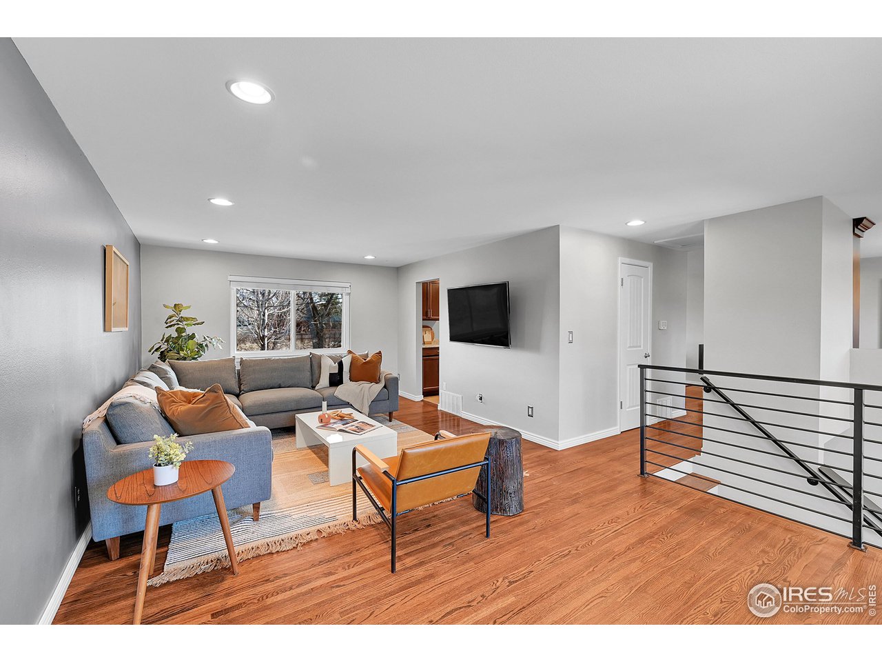 4216 Evans Drive Boulder, CO 80303 - Photo 5 of 26 a living room with furniture and a flat screen tv