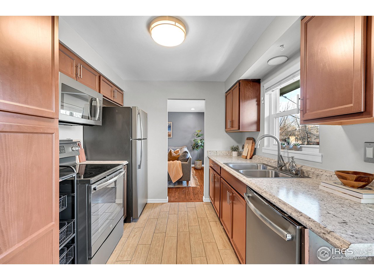 4216 Evans Drive Boulder, CO 80303 - Photo 7 of 26 a kitchen with stainless steel appliances granite countertop a sink stove and refrigerator