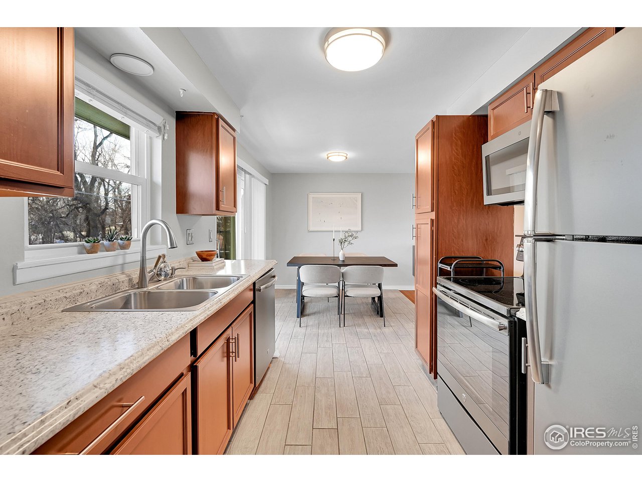4216 Evans Drive Boulder, CO 80303 - Photo 8 of 26 a kitchen with sink stove and refrigerator