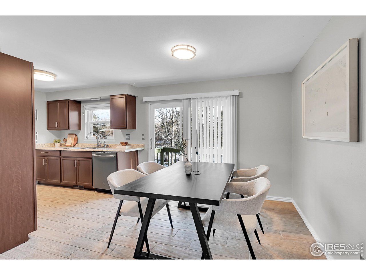 4216 Evans Drive Boulder, CO 80303 - Photo 9 of 26 a open dining room with a table chairs and entryway
