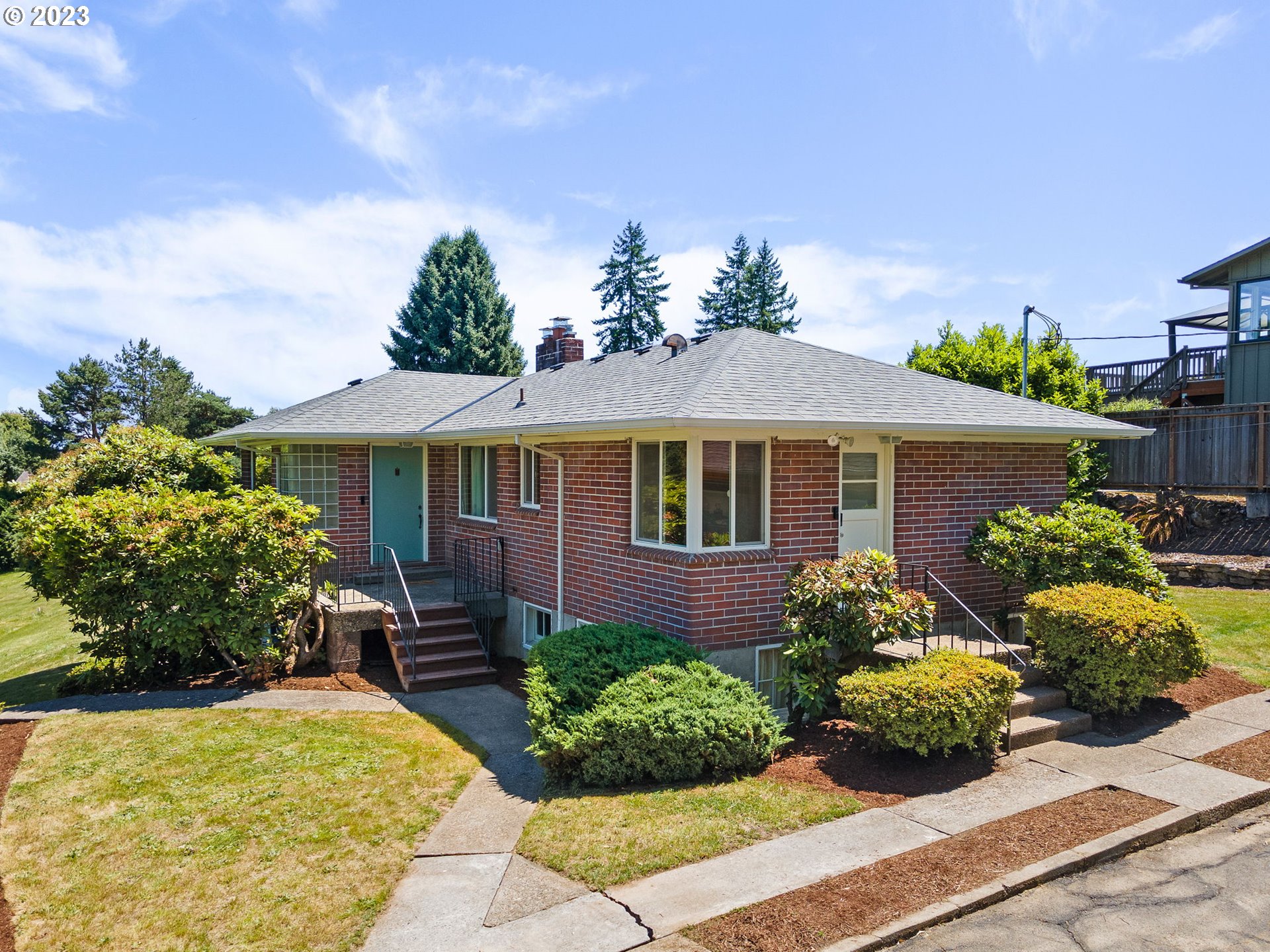 12050 Southwest 29th Avenue Portland, OR 97219 - Photo 1 of 36 front view of a house with a yard
