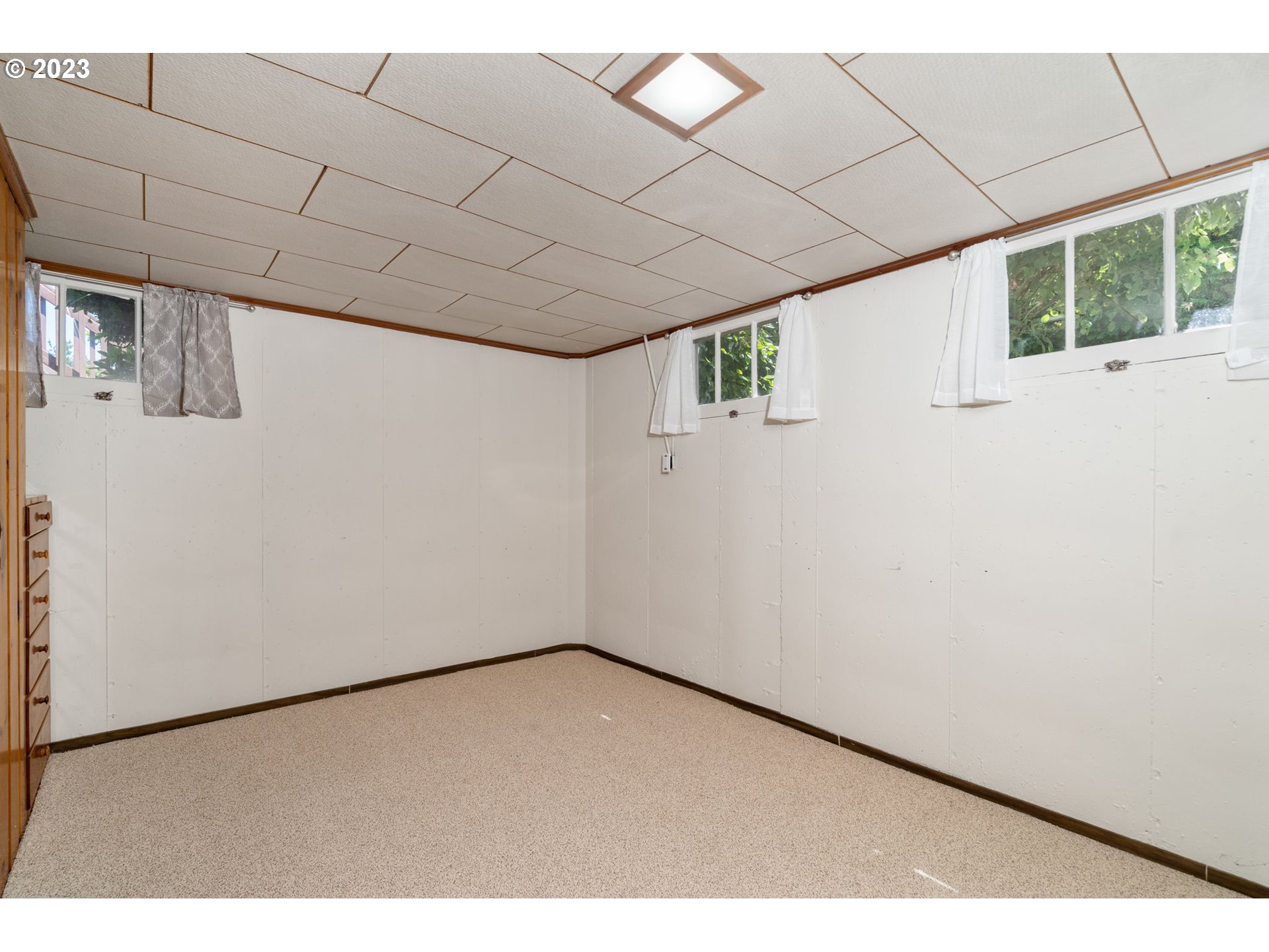 12050 Southwest 29th Avenue Portland, OR 97219 - Photo 25 of 36 a view of an empty room with a window